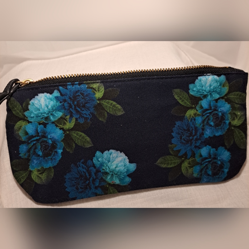 J-Jill black cosmetic bag with blue flowers and zipper.